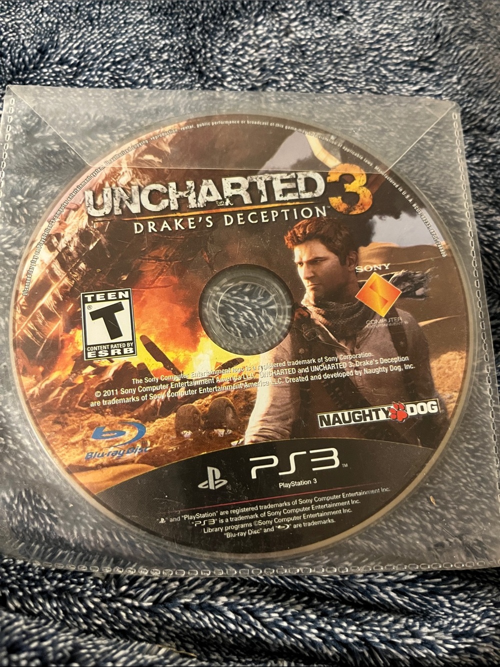 Uncharted 3: Drake's Deception (PS3) - Black/Orange Game Disc